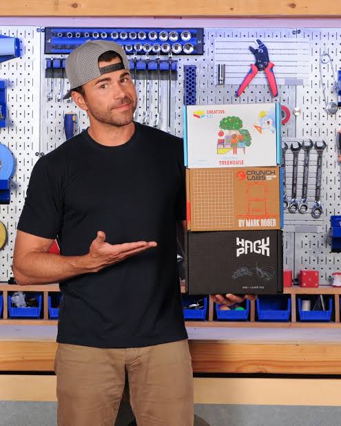 Mark Rober holding Crunchlabs build boxes
